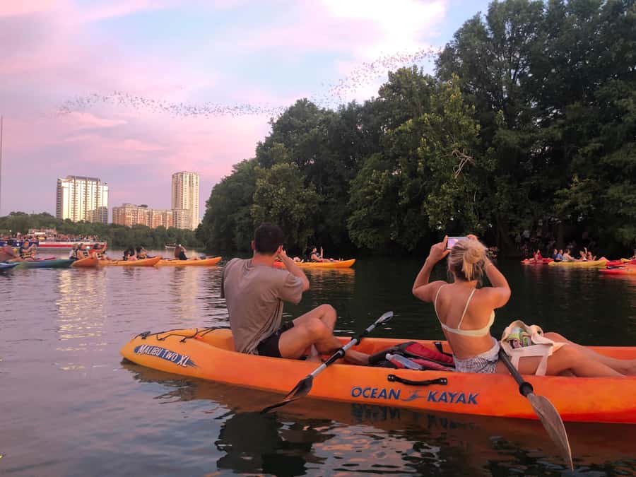 Downtown Sunset Tandem Kayak with 1.5M Bats - Kayaks vs Giant Paddle Boards: Picking the Right Vessel for Your Group